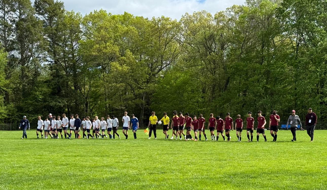 Boys grade 7-8 teams lined up along with their opponents
